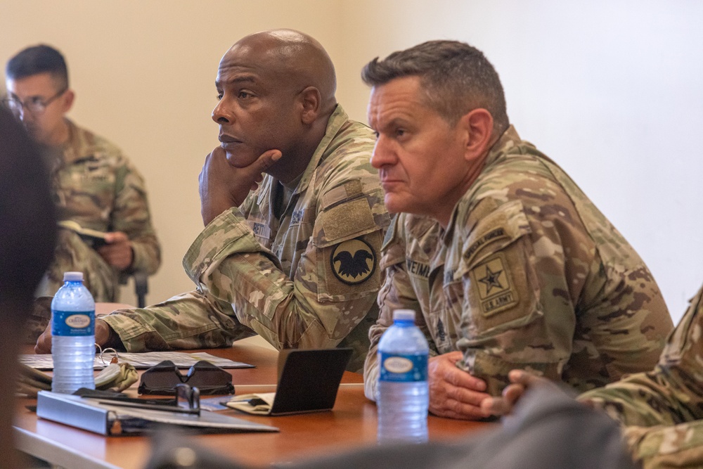 Sgt. Maj. of the Army Michael R. Weimer and Command Sgt. Maj. Gregory Betty listen to a brief