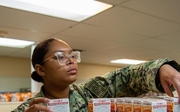 Ronald Reagan Sailors operate the ship’s store