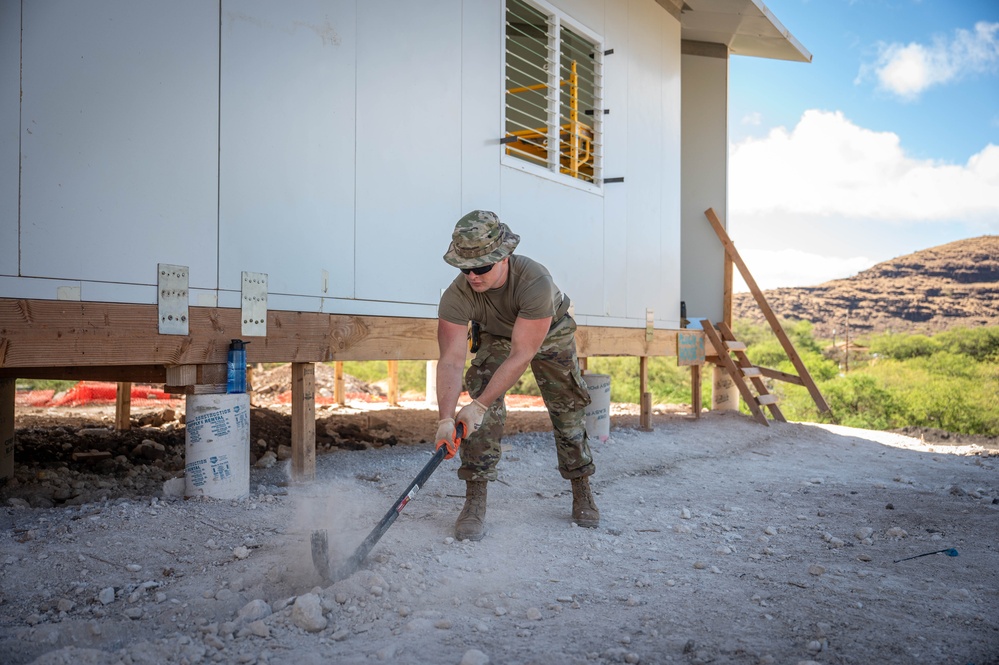 Airman digs trenches for water lines