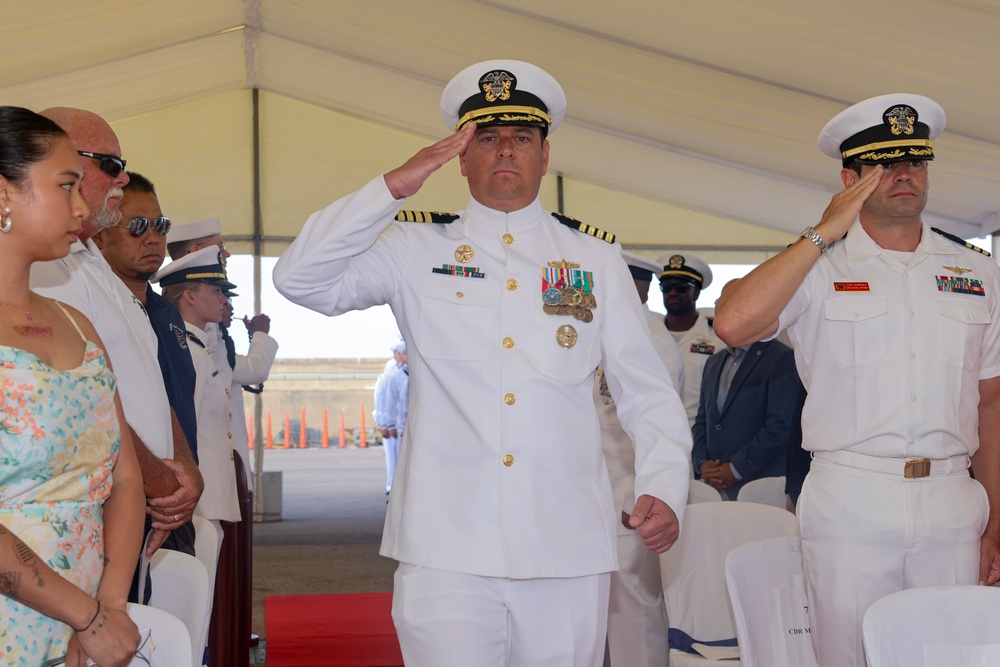Capt. Alexander Mamikonian is piped onto stage as the keynote speaker for USS BULKELEY change of command