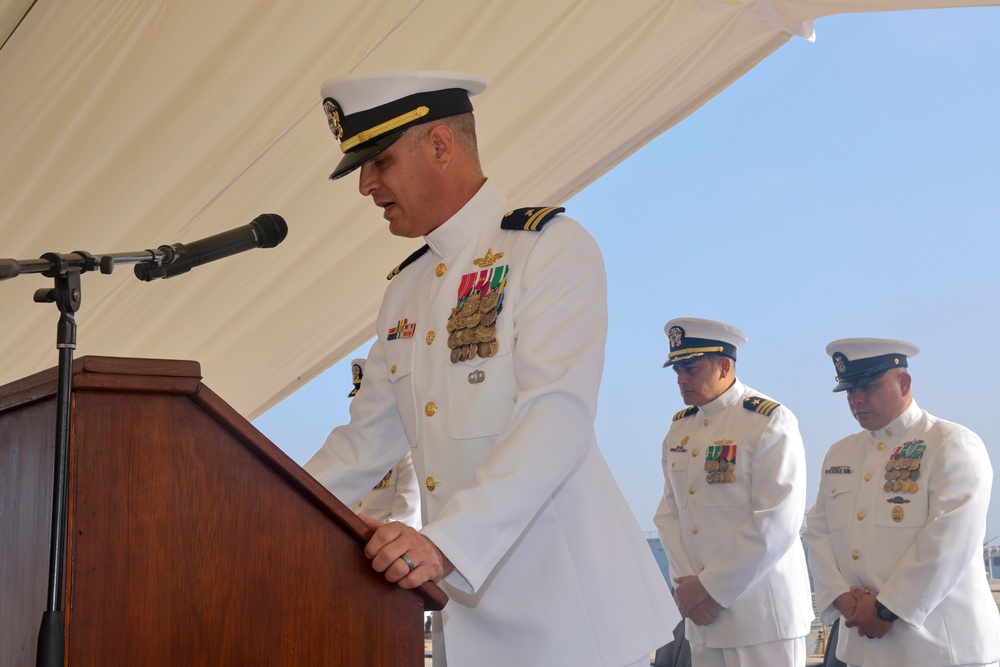 Lt. Joshua Keats delivers an invocation during a change of command ceremony
