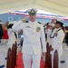Cmdr. Michael Schelcher is rung off the stage during the USS BULKELEY change of command ceremony