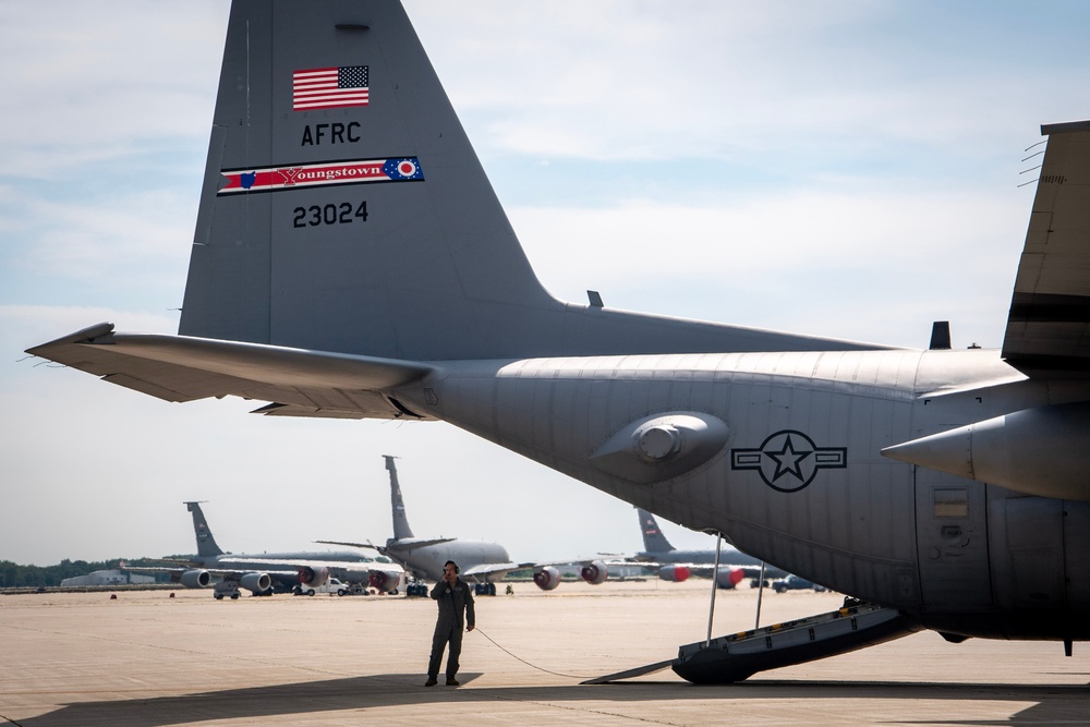 U.S. Reserve Airmen exit a C-130 Super Hercules upon arrival for Patriot Medic 25