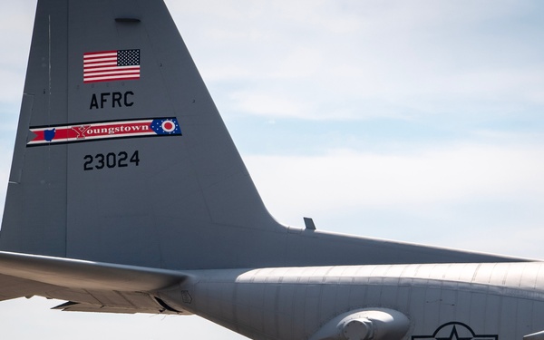 U.S. Reserve Airmen exit a C-130 Super Hercules upon arrival for Patriot Medic 25