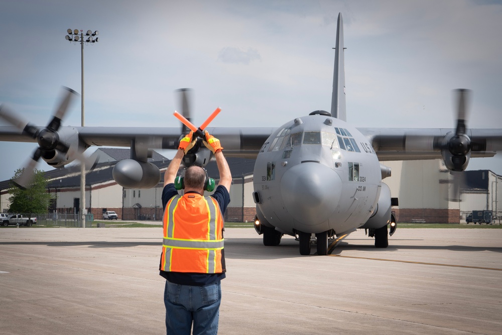 U.S. Reserve Airmen exit a C-130 Super Hercules upon arrival for Patriot Medic 25