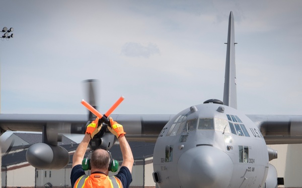 U.S. Reserve Airmen exit a C-130 Super Hercules upon arrival for Patriot Medic 25