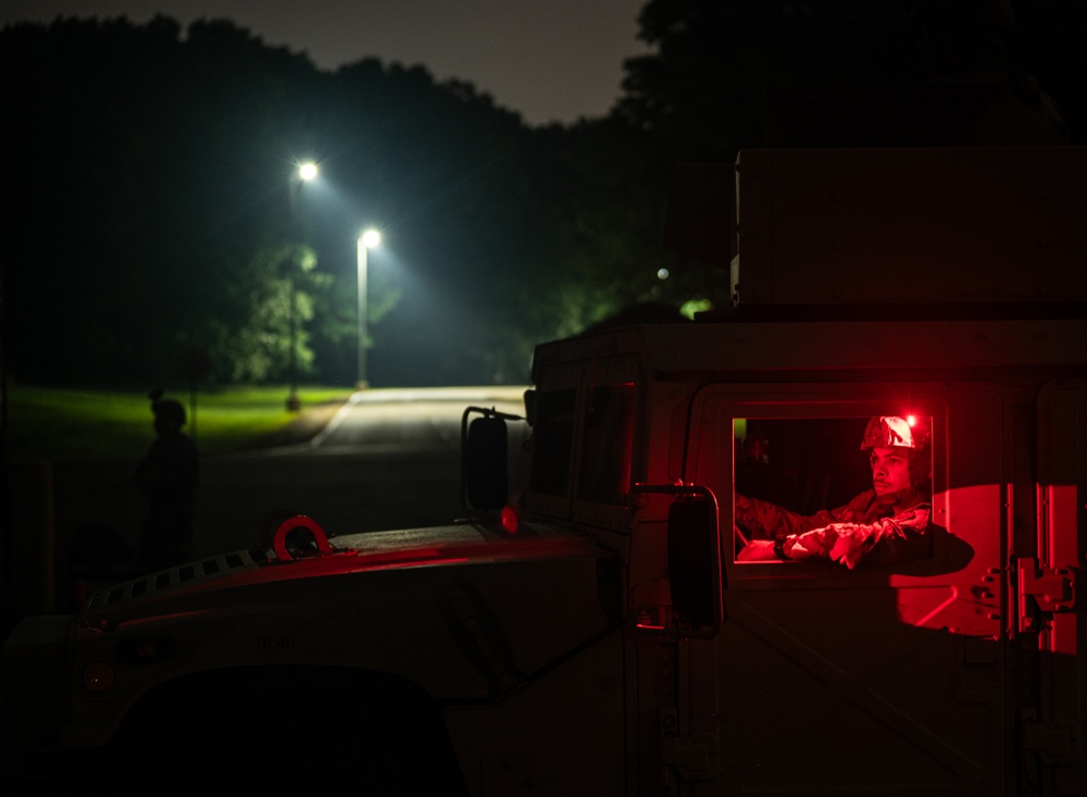 Airmen stand watch at night during Exercise Northern Strike 25-2