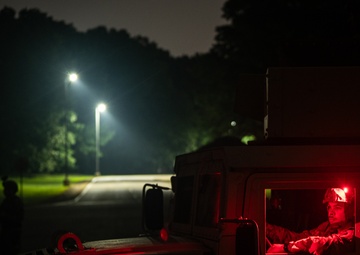 Airmen stand watch at night during Exercise Northern Strike 25-2