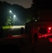 Airmen stand watch at night during Exercise Northern Strike 25-2