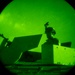 Airmen stand watch at night during Exercise Northern Strike 25-2