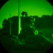 Airmen stand watch at night during Exercise Northern Strike 25-2