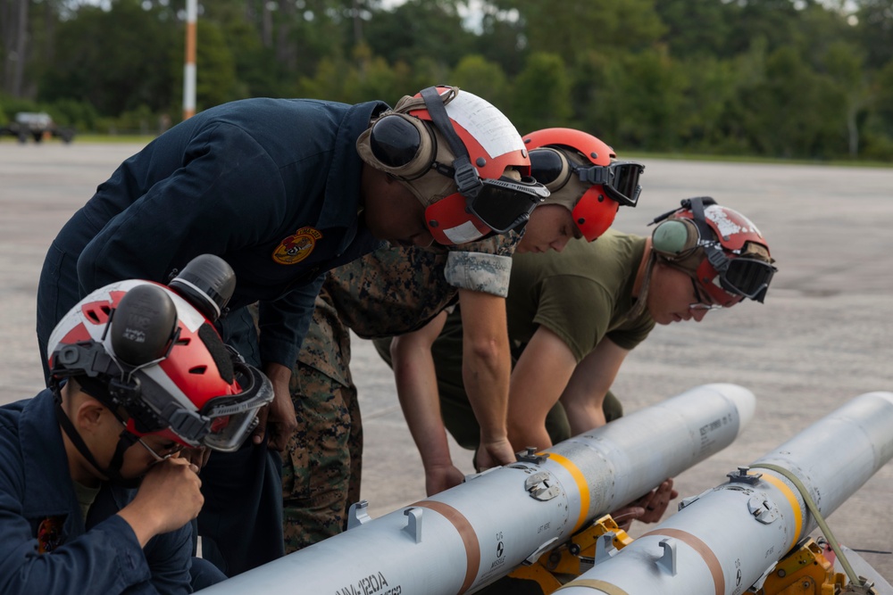 U.S. Marines with Marine Attack Squadron 223 prepare AV-8B Harriers for ordnance training