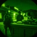 Airmen stand watch at night during Exercise Northern Strike 25-2