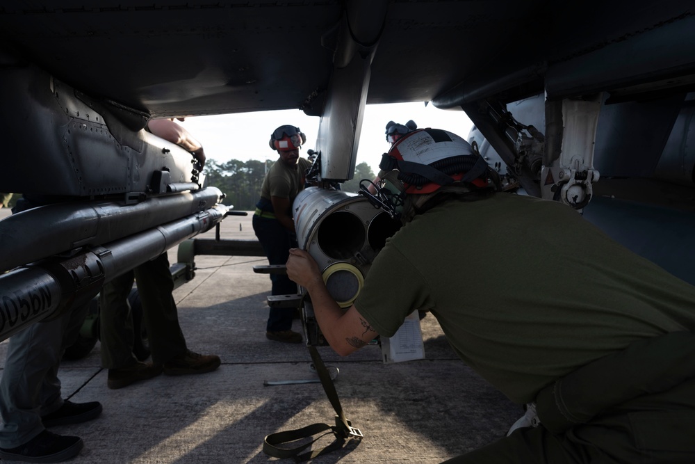 U.S. Marines with Marine Attack Squadron 223 prepare AV-8B Harriers for ordnance training