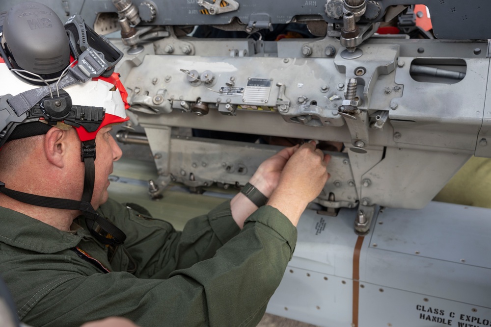U.S. Marines with Marine Attack Squadron 223 prepare AV-8B Harriers for ordnance training