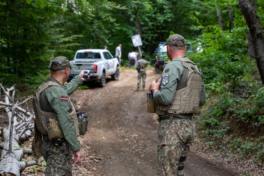 NATO-led KFOR mission along with local contractors install signs along the ABL