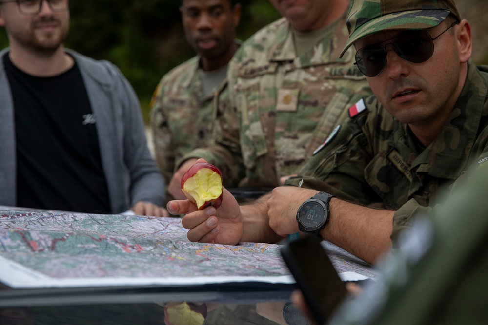 NATO-led KFOR mission along with local contractors install signs along the ABL