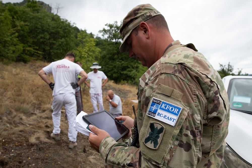 NATO-led KFOR mission along with local contractors install signs along the ABL
