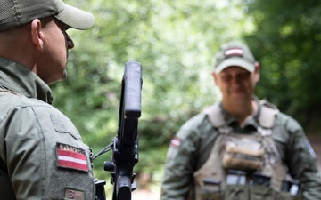 NATO-led KFOR mission along with local contractors install signs along the ABL