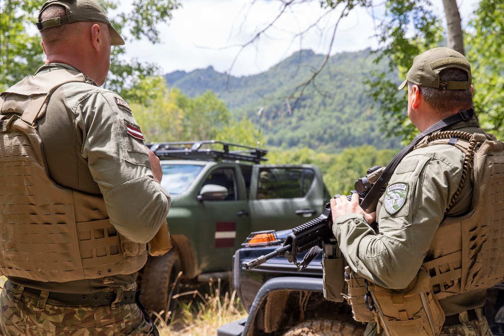 NATO-led KFOR mission along with local contractors install signs along the ABL