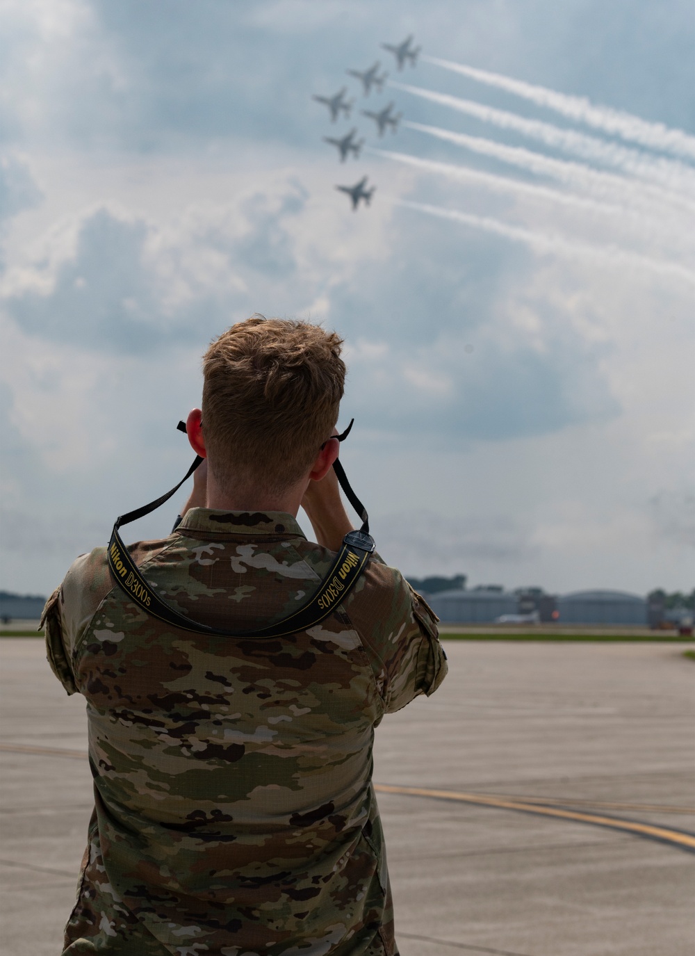 U.S. Airmen take in the action at the 2025 Fort Wayne Air Show