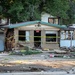 U.S. National Guard Soldier helps rescue 8 people from a flooded home.