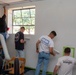 U.S. Marines with HQ Bn., 1st MARDIV paint George’s Place