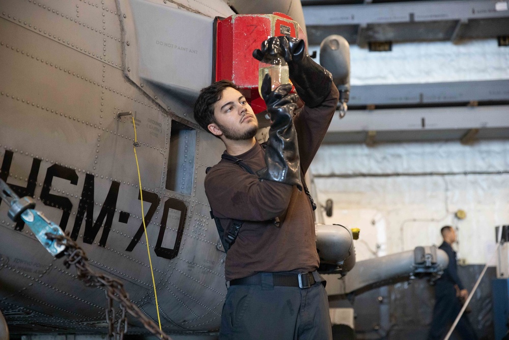 HSM 70 Sailor Conducts Fuel Sample Test