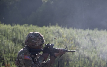 1092nd Engineer Battalion Cmd. Sgt. Maj. Hammack Shoot Match contenders compete in a rifle to pistol transition drill