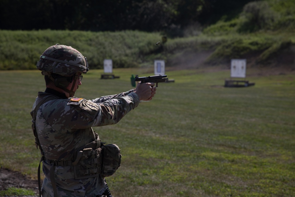 1092nd Engineer Battalion Cmd. Sgt. Maj. Hammack Shoot Match contenders compete in a rifle to pistol transition drill