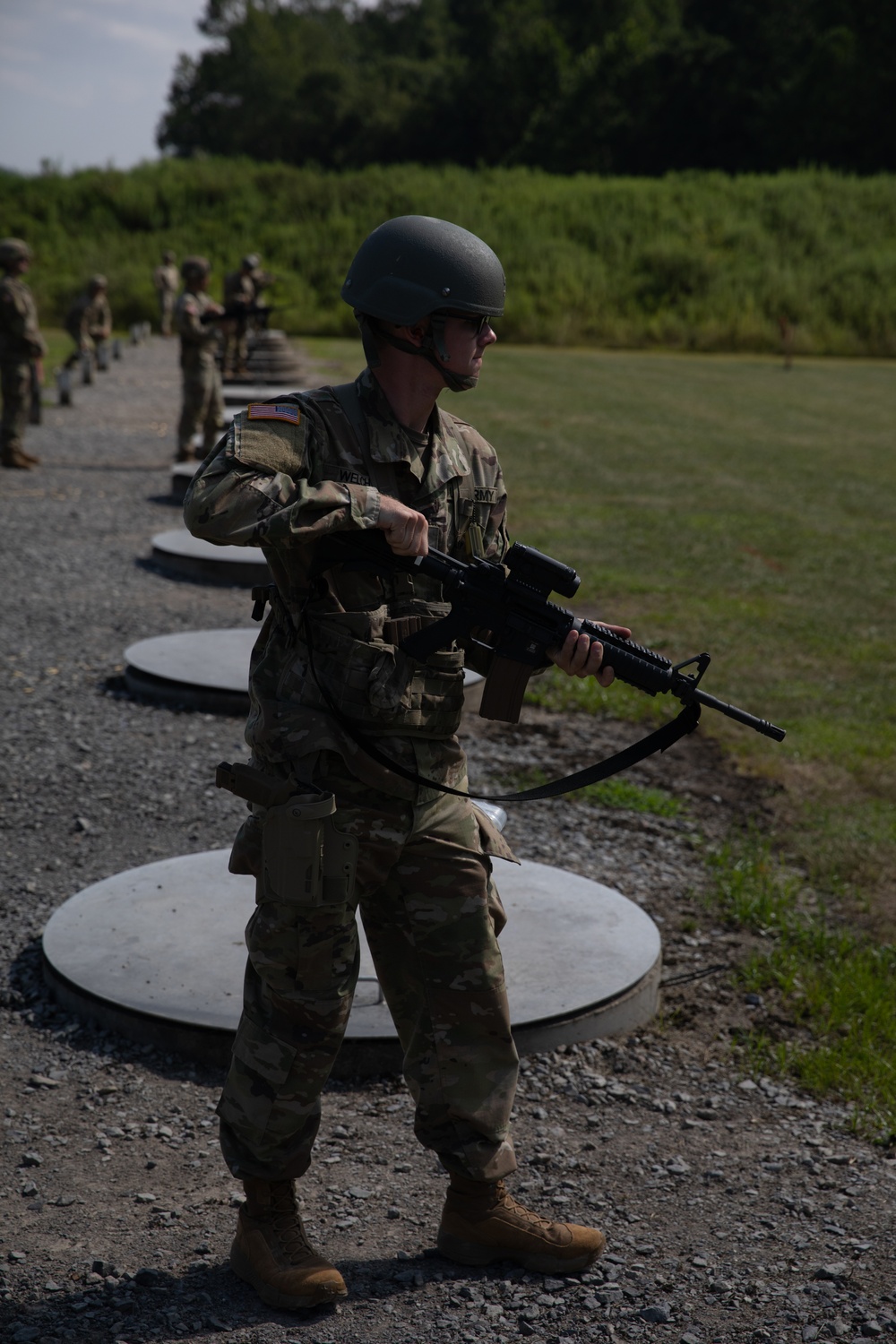 1092nd Engineer Battalion Cmd. Sgt. Maj. Hammack Shoot Match contenders compete in a rifle to pistol transition drill