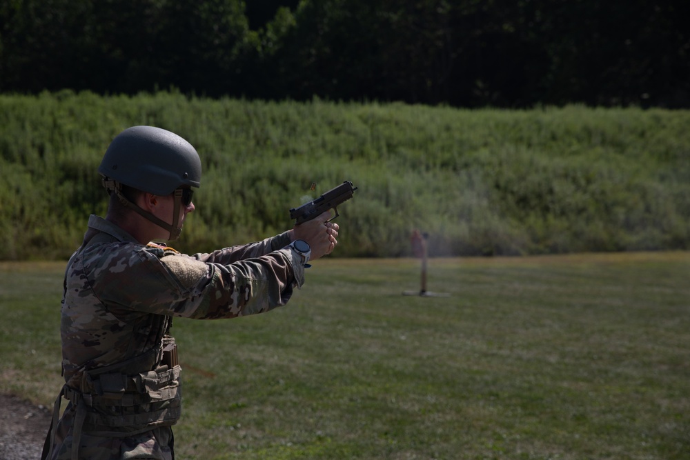 1092nd Engineer Battalion Cmd. Sgt. Maj. Hammack Shoot Match contenders compete in a rifle to pistol transition drill