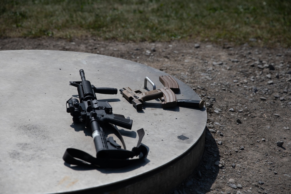 1092nd Engineer Battalion Cmd. Sgt. Maj. Hammack Shoot Match contenders compete in a rifle to pistol transition drill
