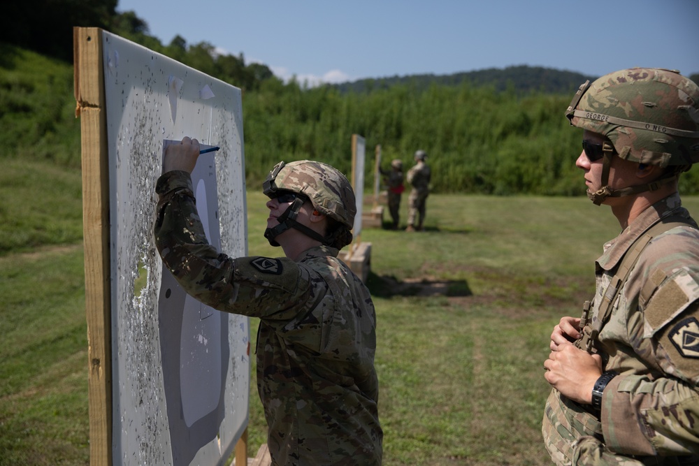 1092nd Engineer Battalion Cmd. Sgt. Maj. Hammack Shoot Match contenders compete in a rifle to pistol transition drill