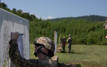 1092nd Engineer Battalion Cmd. Sgt. Maj. Hammack Shoot Match contenders compete in a rifle to pistol transition drill