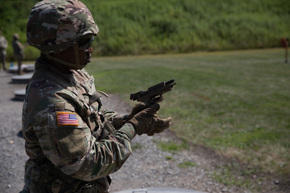 1092nd Engineer Battalion Cmd. Sgt. Maj. Hammack Shoot Match contenders compete in a rifle to pistol transition drill