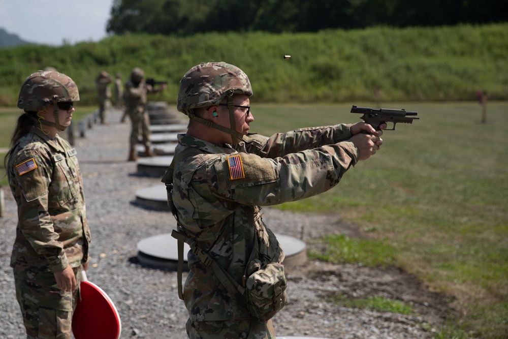 1092nd Engineer Battalion Cmd. Sgt. Maj. Hammack Shoot Match contenders compete in a rifle to pistol transition drill