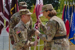 Brig. Gen. Deydre S. Teyhen, commanding general, Medical Readiness Command, Pacific &amp; director, Defense Health Network Indo-Pacific, passes colors to Madigan’s new commander, Col. James “Jimmy” Watts.