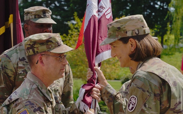 Brig. Gen. Deydre S. Teyhen, commanding general, Medical Readiness Command, Pacific &amp; director, Defense Health Network Indo-Pacific, passes colors to Madigan’s new commander, Col. James “Jimmy” Watts.