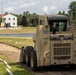 Skid-Steer Clears the Way for Sidewalk