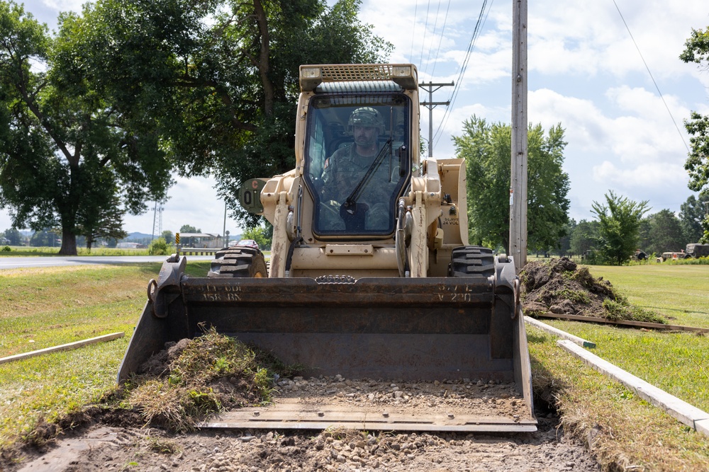 Skid-Steer Clears the Way for Sidewalk