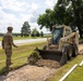 Skid-Steer Clears the Way for Sidewalk