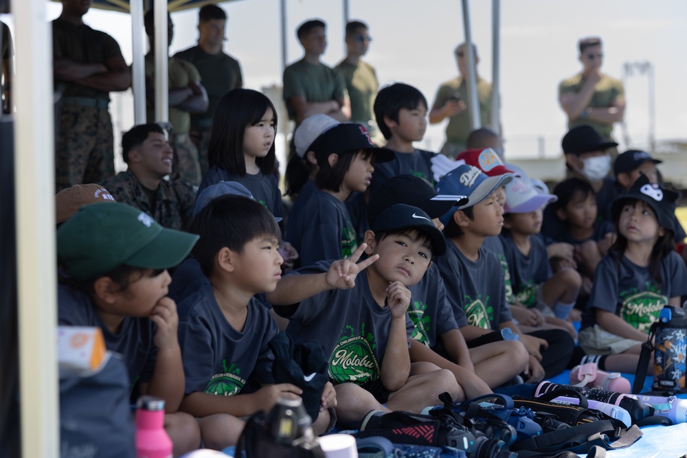 Kamimotobu After-School Children’s Club students tour Camp Schwab