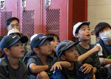 Kamimotobu After-School Children’s Club students tour Camp Schwab