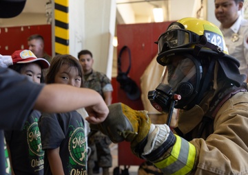 Kamimotobu After-School Children’s Club students tour Camp Schwab