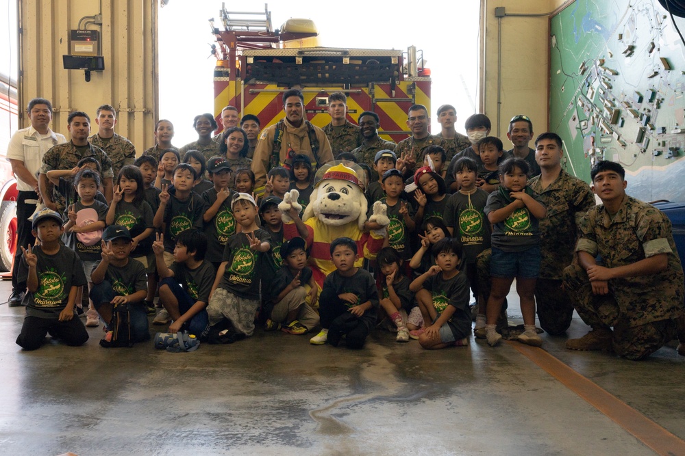Kamimotobu After-School Children’s Club students tour Camp Schwab