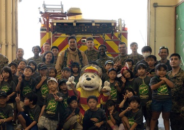 Kamimotobu After-School Children’s Club students tour Camp Schwab