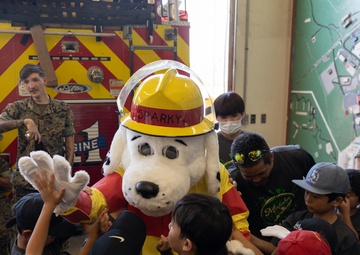 Kamimotobu After-School Children’s Club students tour Camp Schwab