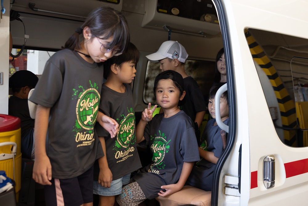 Kamimotobu After-School Children’s Club students tour Camp Schwab