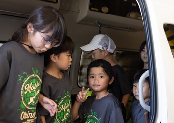 Kamimotobu After-School Children’s Club students tour Camp Schwab